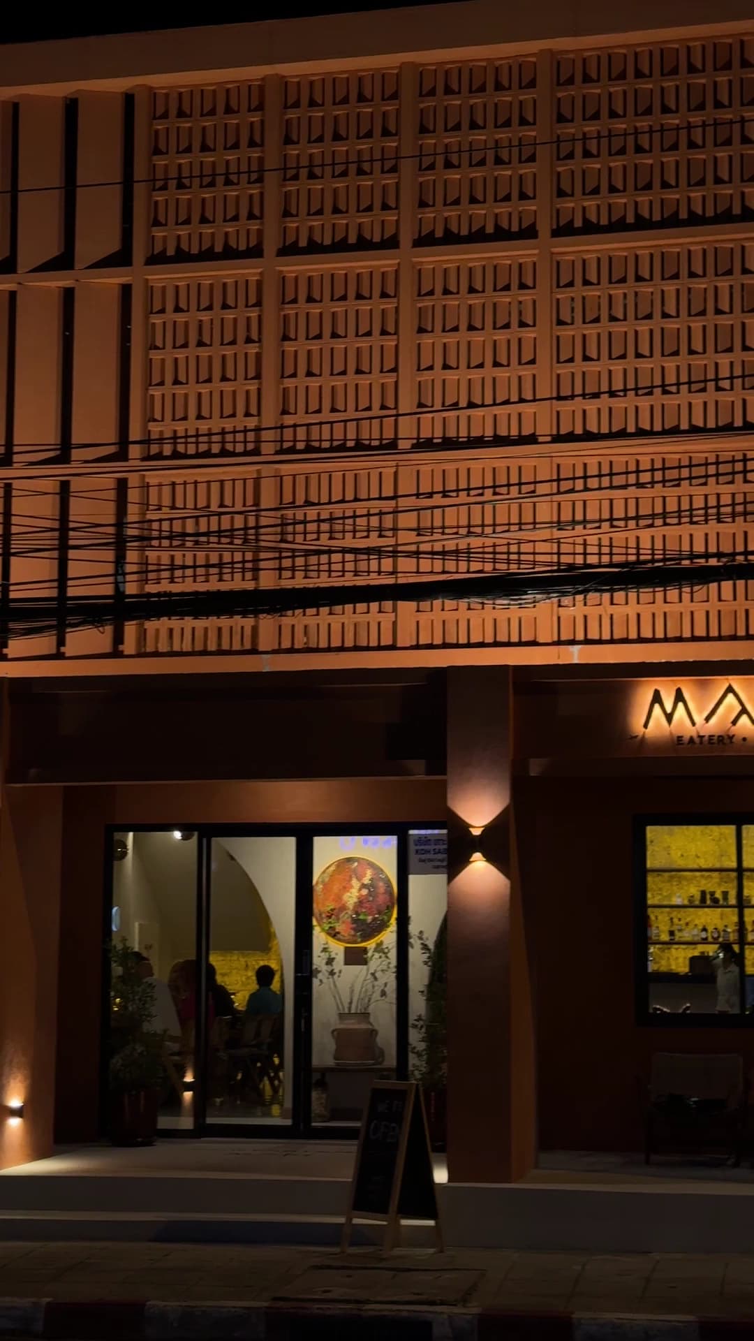 MARS at night — the terracotta breeze-block facade aglow